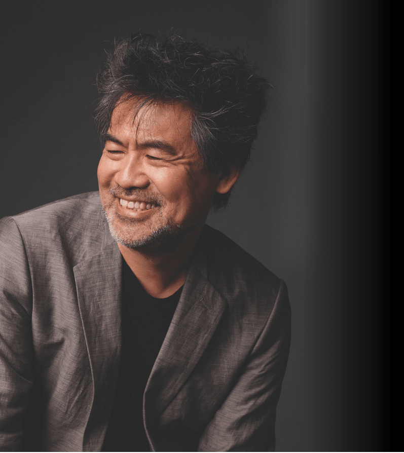 Black and white portrait photograph of David Henry Hwang